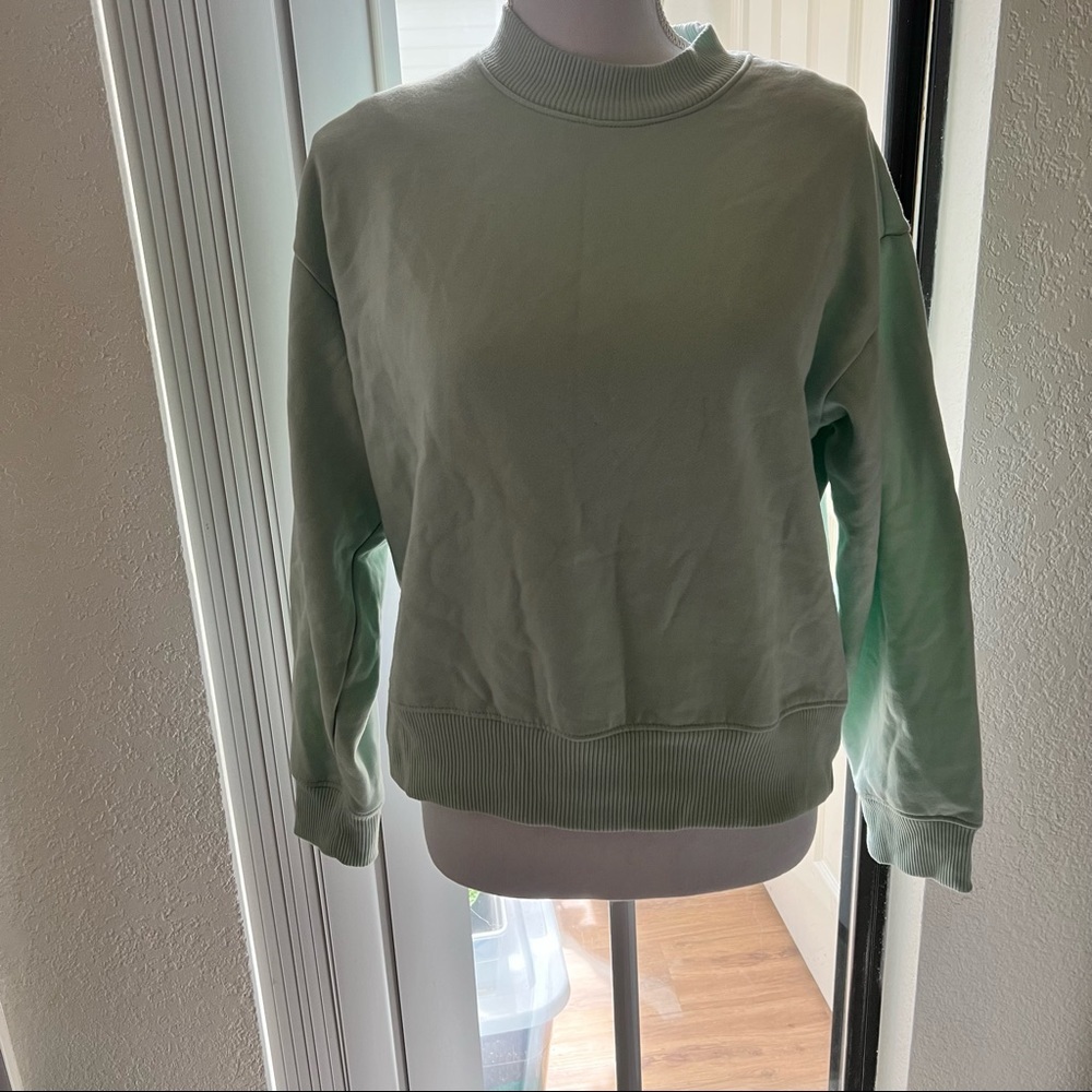 Beautiful light green sweater by a new day​